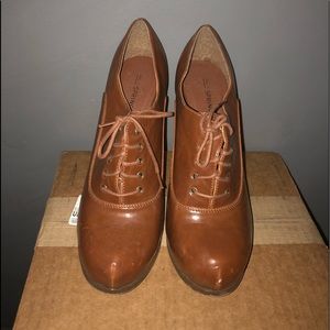 Platform ankle 4 inch tie up shoes.